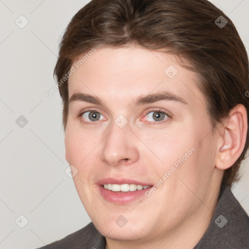 Joyful white young-adult female with medium  brown hair and grey eyes