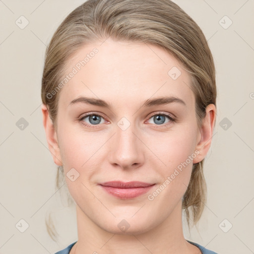 Joyful white young-adult female with medium  brown hair and blue eyes