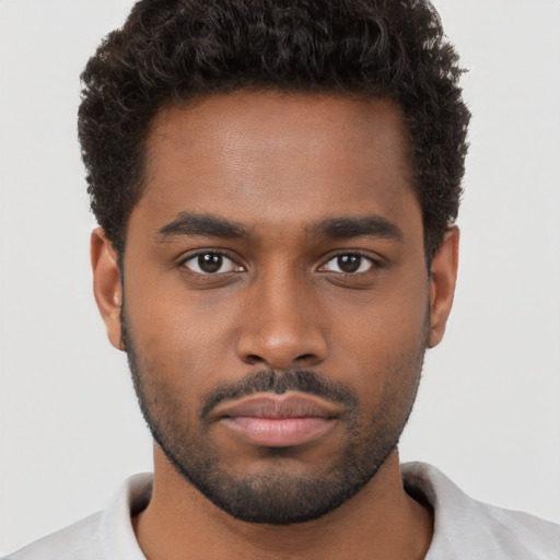 Neutral black young-adult male with short  brown hair and brown eyes