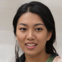 Joyful asian young-adult female with medium  black hair and brown eyes