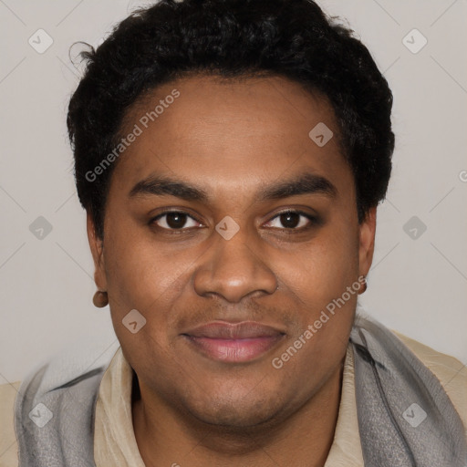 Joyful black young-adult male with short  black hair and brown eyes