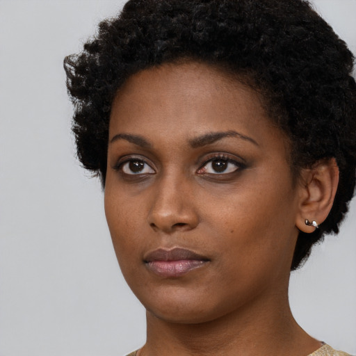Neutral black young-adult female with short  black hair and brown eyes