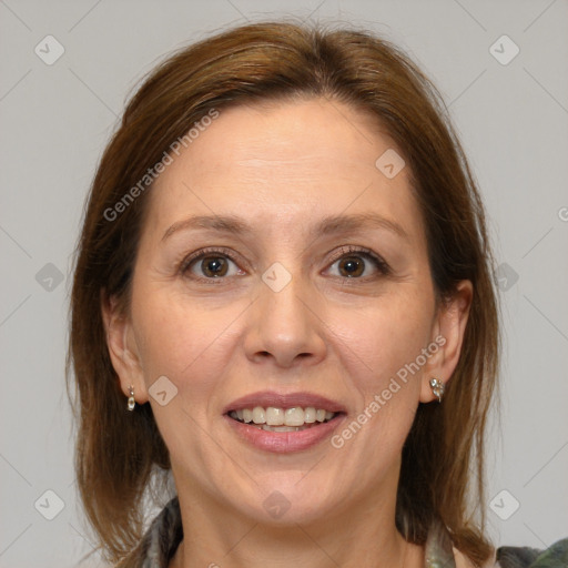 Joyful white adult female with medium  brown hair and brown eyes