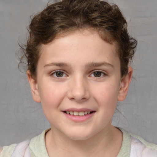 Joyful white child female with short  brown hair and brown eyes