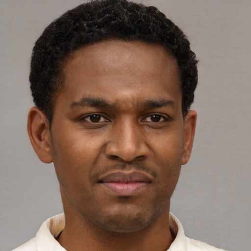 Neutral black young-adult male with short  brown hair and brown eyes