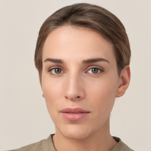 Neutral white young-adult female with short  brown hair and grey eyes