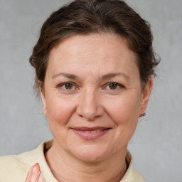 Joyful white adult female with short  brown hair and brown eyes