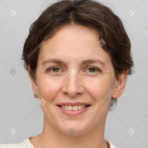 Joyful white adult female with short  brown hair and brown eyes