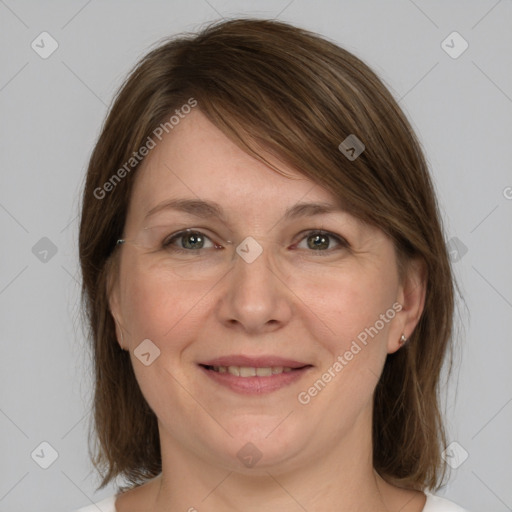 Joyful white adult female with medium  brown hair and grey eyes