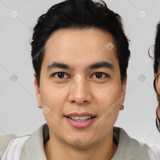 Joyful latino young-adult male with short  brown hair and brown eyes