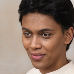 Joyful latino young-adult male with short  brown hair and brown eyes