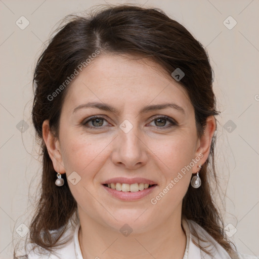 Joyful white adult female with medium  brown hair and grey eyes