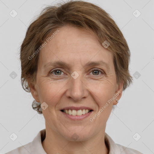 Joyful white adult female with short  brown hair and grey eyes