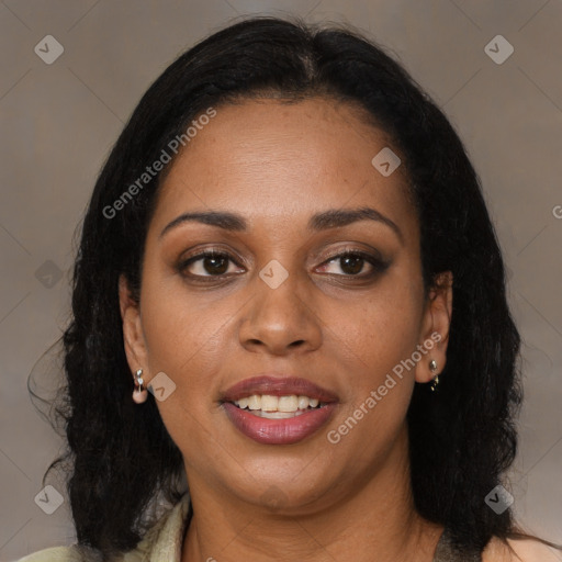 Joyful black adult female with medium  brown hair and brown eyes