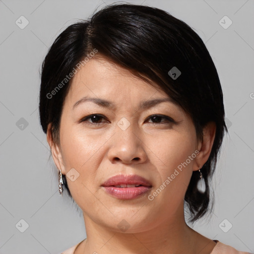 Joyful white adult female with medium  brown hair and brown eyes