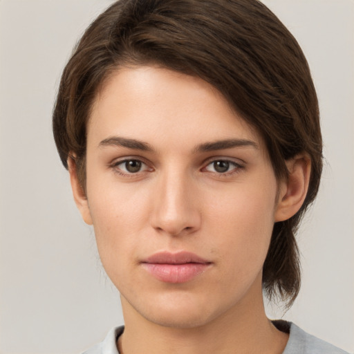 Neutral white young-adult female with medium  brown hair and brown eyes