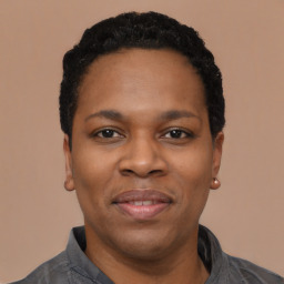 Joyful black young-adult female with short  black hair and brown eyes