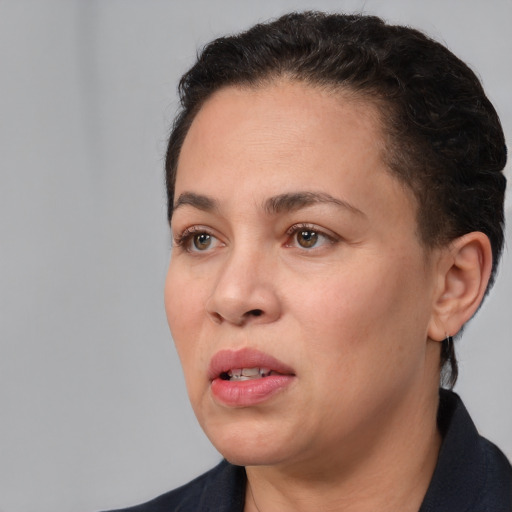 Neutral white young-adult female with short  black hair and brown eyes