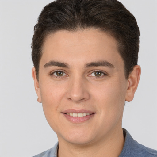 Joyful white young-adult male with short  brown hair and brown eyes