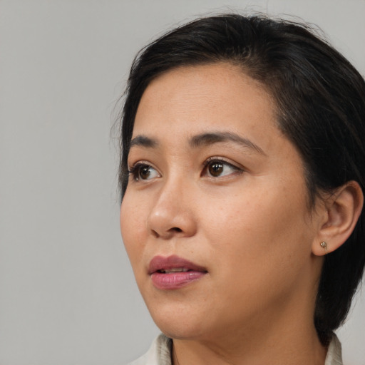 Neutral asian young-adult female with medium  black hair and brown eyes
