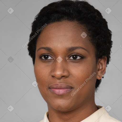 Joyful black young-adult female with short  black hair and brown eyes