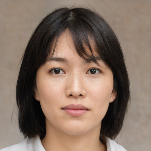 Neutral asian young-adult female with medium  brown hair and brown eyes