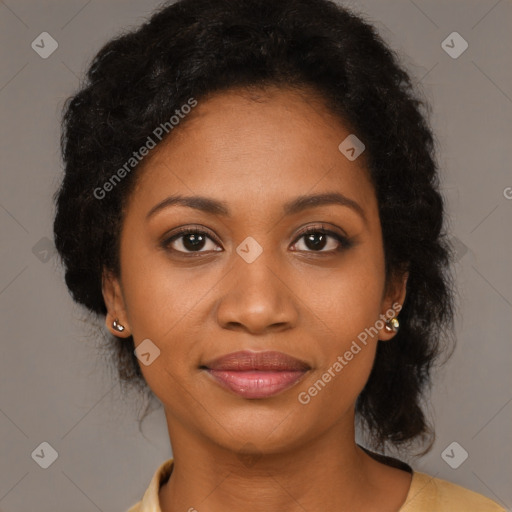 Joyful black young-adult female with long  brown hair and brown eyes