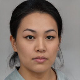 Neutral asian young-adult female with medium  brown hair and brown eyes