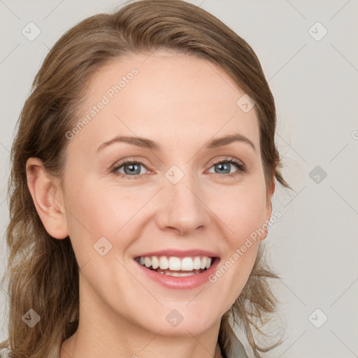 Joyful white young-adult female with medium  brown hair and blue eyes