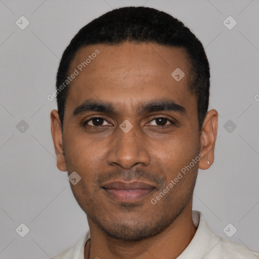 Joyful black young-adult male with short  black hair and brown eyes