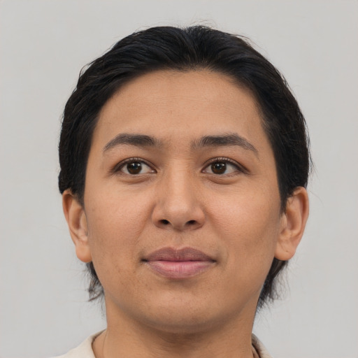 Joyful asian young-adult female with medium  brown hair and brown eyes