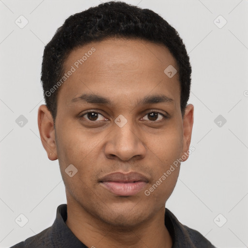 Joyful black young-adult male with short  black hair and brown eyes