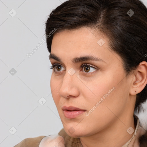 Neutral white young-adult female with medium  brown hair and brown eyes