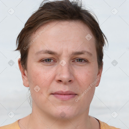 Joyful white adult female with short  brown hair and grey eyes