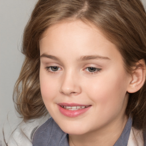 Joyful white child female with medium  brown hair and brown eyes