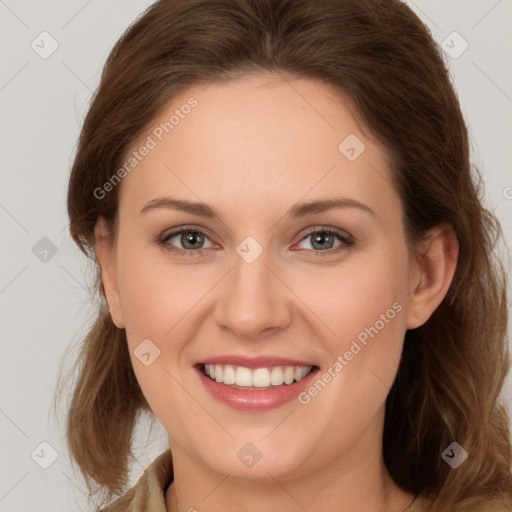 Joyful white young-adult female with long  brown hair and green eyes