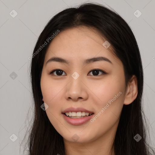 Joyful asian young-adult female with long  brown hair and brown eyes