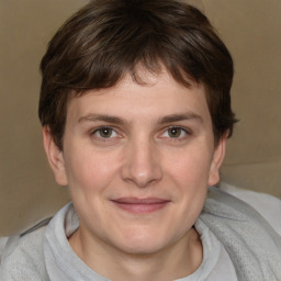 Joyful white young-adult male with medium  brown hair and brown eyes