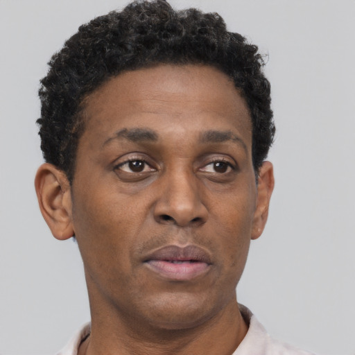 Neutral black adult male with short  brown hair and brown eyes