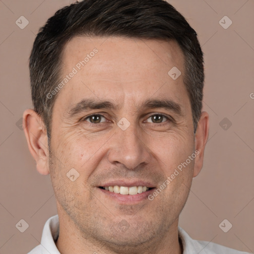 Joyful white adult male with short  brown hair and brown eyes