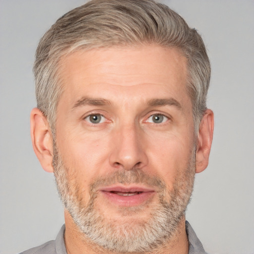 Neutral white adult male with short  gray hair and brown eyes