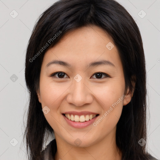 Joyful asian young-adult female with long  brown hair and brown eyes