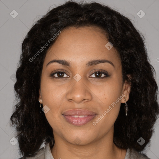 Joyful black young-adult female with long  brown hair and brown eyes