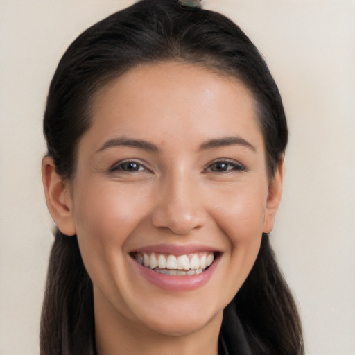 Joyful white young-adult female with long  brown hair and brown eyes