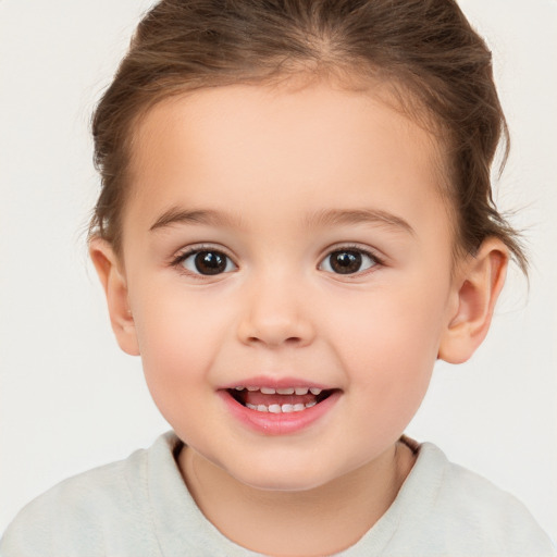 Joyful white child female with short  brown hair and brown eyes