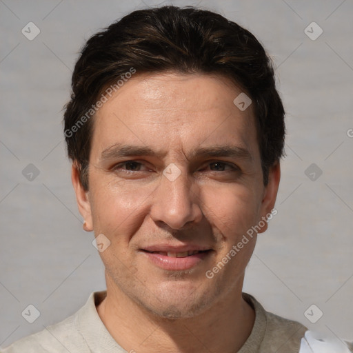 Joyful white adult male with short  brown hair and brown eyes