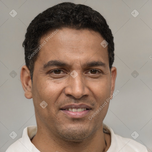 Joyful latino young-adult male with short  brown hair and brown eyes