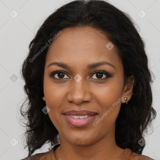 Joyful black young-adult female with long  brown hair and brown eyes