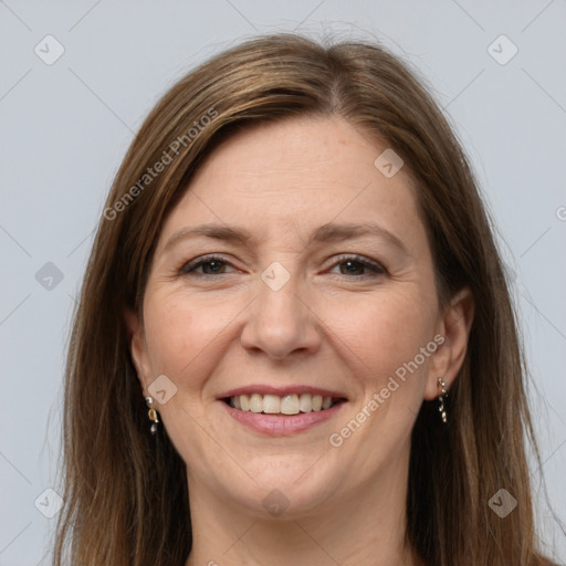 Joyful white adult female with long  brown hair and brown eyes