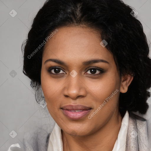 Joyful black young-adult female with long  black hair and brown eyes